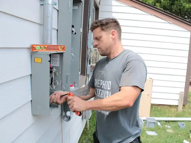 Walter Shepherd inspecting a residential electrical panel